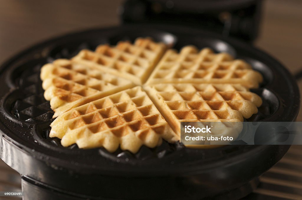 Waffles Waffles with a waffle iron. Waffle Iron Stock Photo