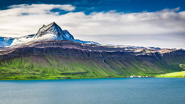 Volcanic mountain over fjord in Iceland