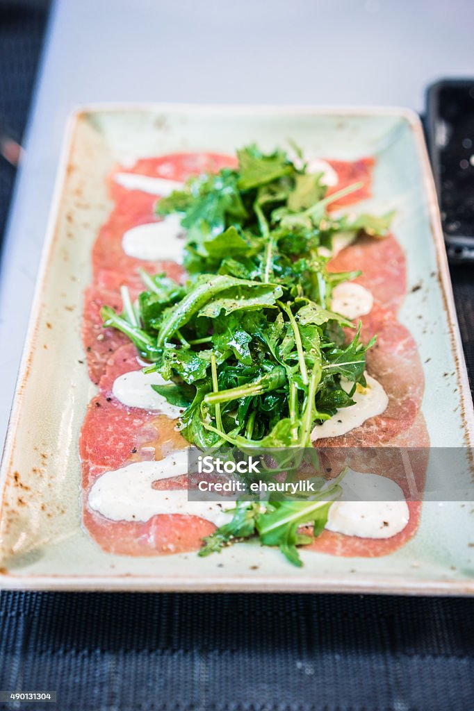 Beef carpaccio with arugula Appetizer Stock Photo