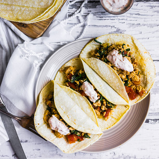 istock Tacos with chicken and vegetables on white wooden background 490131412