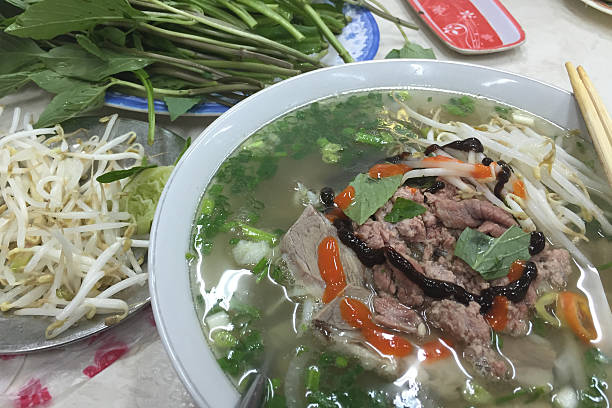 istock Vietnamese Pho Noodles Soup with condiments 490131990