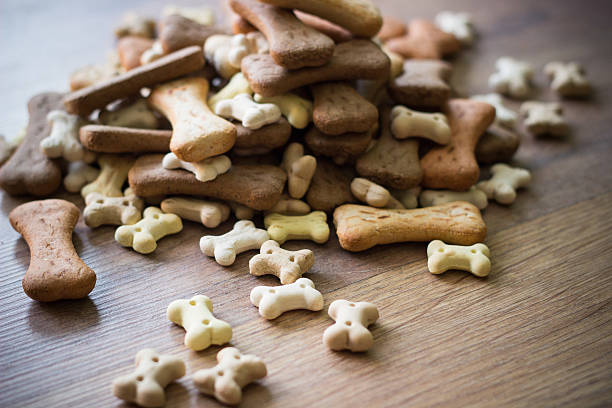 Pet food, dog bones Dog biscuits on wooden background dog biscuit photos stock pictures, royalty-free photos & images