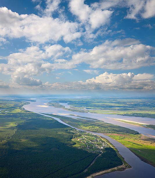 istock Top view of the village biside forest river 490132195