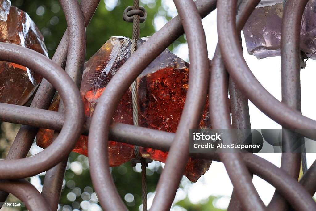 Detail of iron gates near Basilica of the Holy Cross Rome, Italy - August 17, 2015: Details of the Iron gates with multicolored stones near the Basilica of the Holy Cross in Jerusalem 2015 Stock Photo