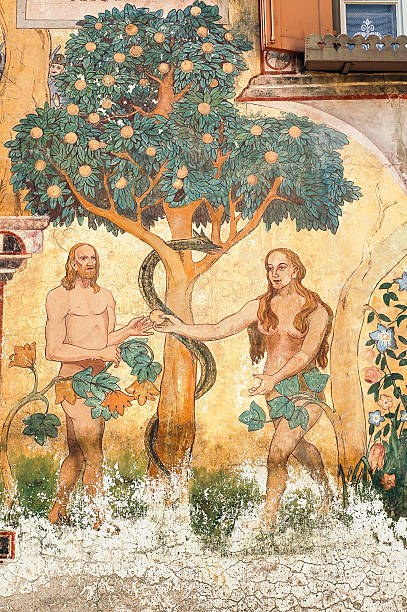 Ardez (Engadine): Adam and Eve Ardez, Switzerland - July 14, 2006: Ardez, typical village of Swiss Alps, in Engadine (Graubunden, Switzerland): Chasa Claguna, historic house with frescos representing Adam and Eve adam and eve painting stock pictures, royalty-free photos & images