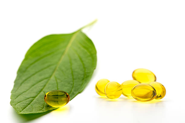 phytotherapy - capsule pill gel effect green стоковые фото и изображения