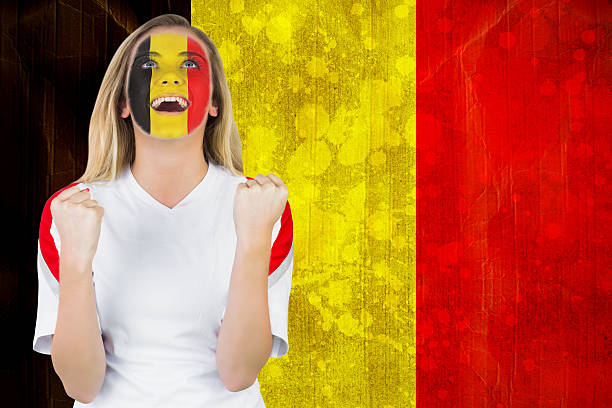 Excited belgium fan in face paint cheering