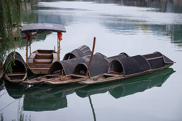 Dark-awninged boat,was taken in Zhenyuan,Guizhou,China.