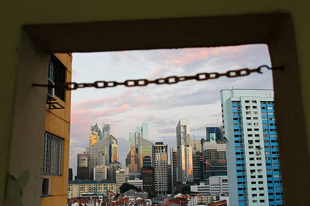 istock Chain link across Singapore skyline 490135806