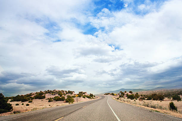 A section of West Old Highway 66, also known as “Historic Route 66”, between the towns of Seligman, Arizona, and Ash Fork, Arizona in late afternoon.