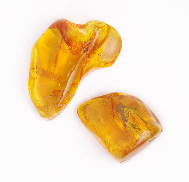istock amber gemstone on white. Soft focus, photo toned 490139066