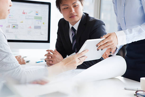 istock People who use the tablet in a meeting 490139296