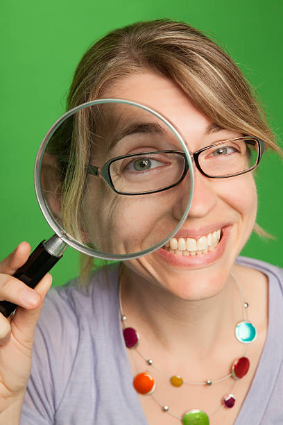 istock Woman with Magnifying Glass 490140612