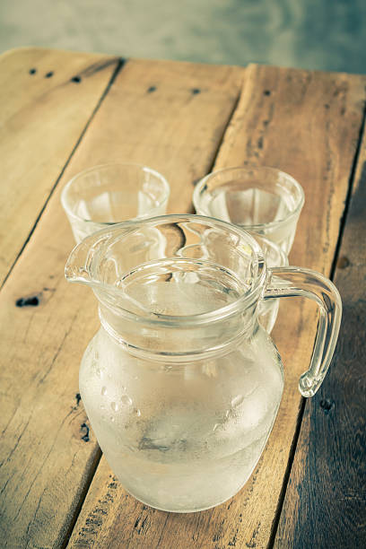 istock Glass pitcher of water and glass. 490142062