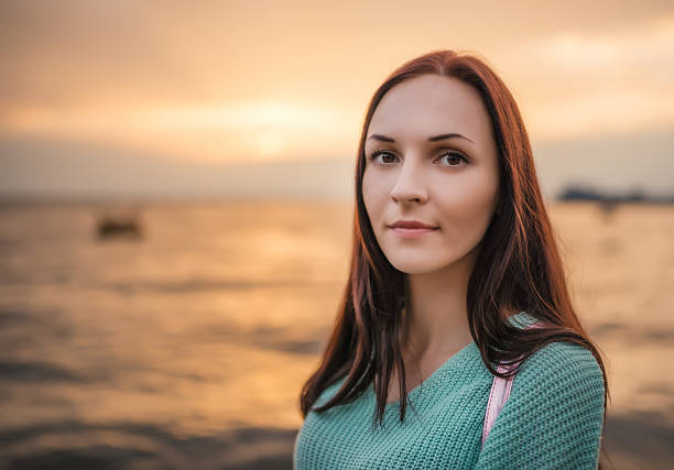 istock Young woman at sunset. 490173506