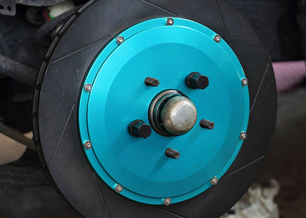 istock close up of blue front disc brake on car 490175338