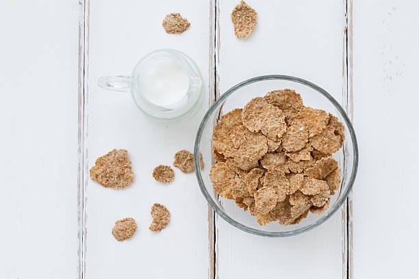 Bran flakes Bran flakes - top view healthy breakfast composition bran flakes stock pictures, royalty-free photos & images