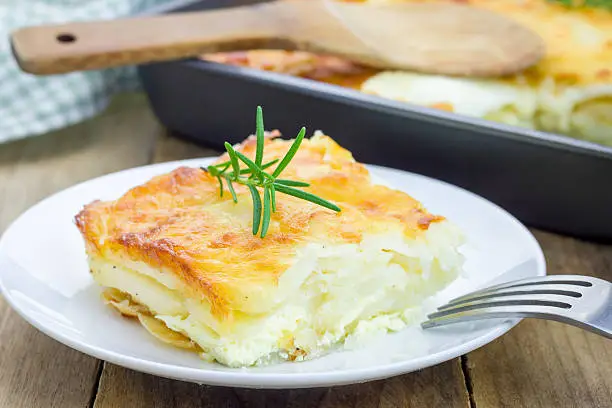 Potato gratin on a white plate