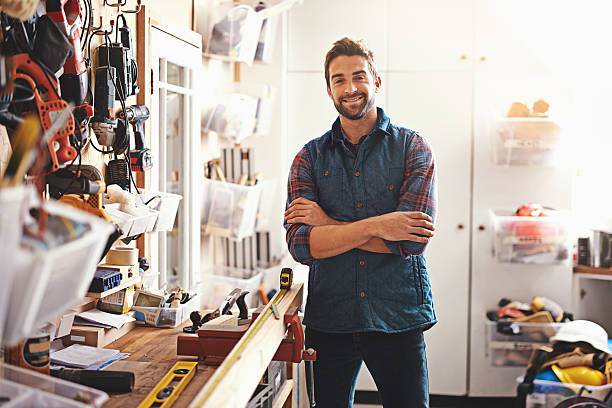 You've found the right man for the job! Portrait of a man standing in his workshophttp://195.154.178.81/DATA/i_collage/pi/shoots/784177.jpg carpenter portrait stock pictures, royalty-free photos & images