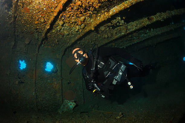 istock Scuba diver  inside shipwreck   WRECK DIVING  Underwater reef  Red Sea 490177588