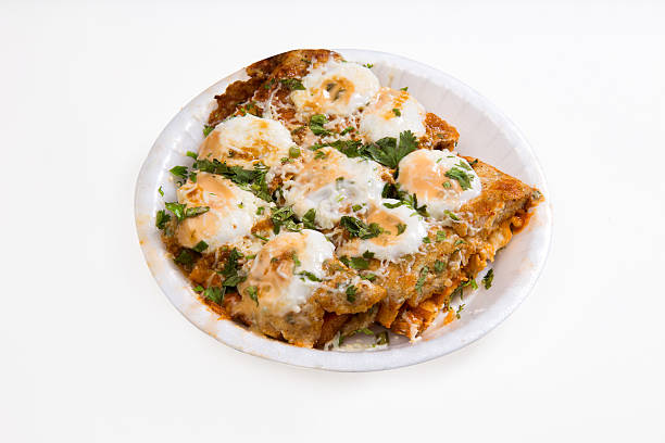 Homemade Mexican Chilaquiles with Fried Egg and Refried Beans