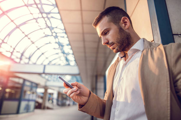 istock Serious businessman reading a text message on mobile phone. 490178668