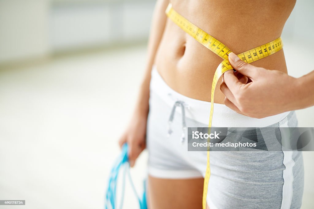 Losing weight Every woman wants to keep fit Tape Measure Stock Photo