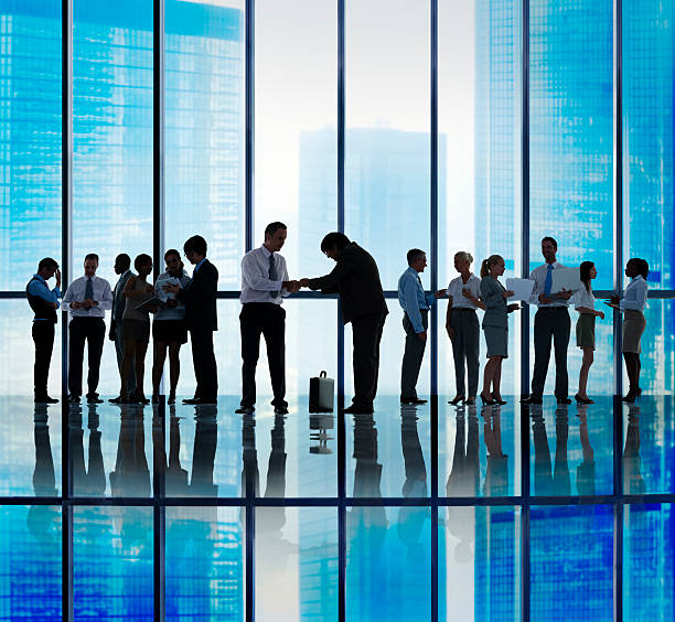 istock Silhouette Group of Business People Greeting Concept 490180836