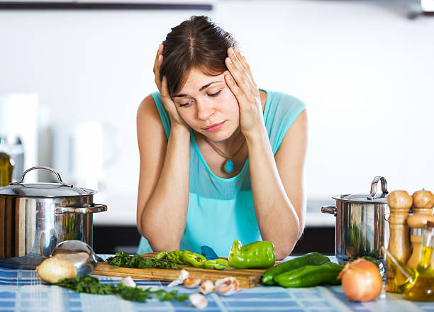 istock Sad housewife cooking dinner 490184458
