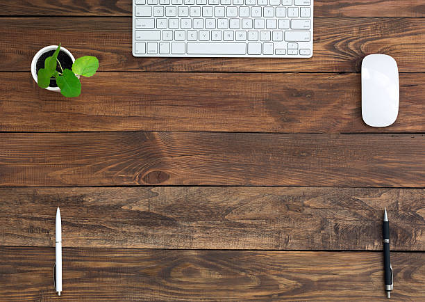 istock Brown Wooden Desk with Stationery and Electronics 490185866