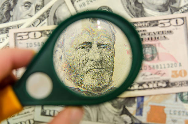 istock US 50 dollars under a magnifying glass. close-up 490185984