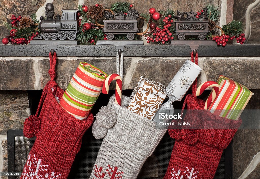 Christmas stockings Stuffed stockings hanging on a fireplace on christmas morning Christmas Stocking Stock Photo