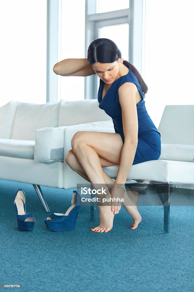 Foot Pain Young Woman Massage Her Tired Legs Stock Photo - Download ...