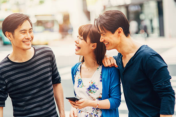 istock Happy japanese friends surfing the net 490187240