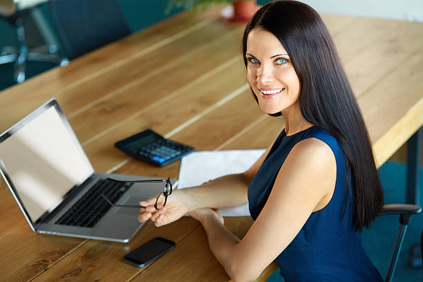 istock Business Woman using her Laptop Computer at office 490188480