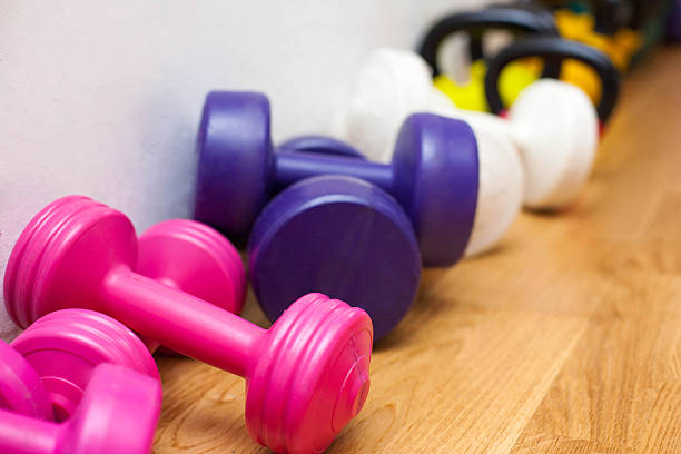 istock Dumbbells on the gym floor 490203079