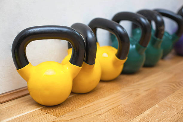 istock Kettle bells on the floor in the gym 490203115