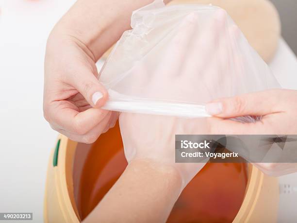 Female Hand And Paraffin Wax Bowl Woman In Beauty Salon Stock Photo - Download Image Now