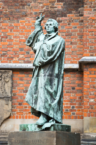 Monument of Martin Luther in Wittenberg, Germany. It was the first public monument of the great reformer, designed 1821 by Johann Gottfried Schadow. Martin Luther (1483-1546) was a German monk, theologian, and church reformer and the translator of the bible into German.