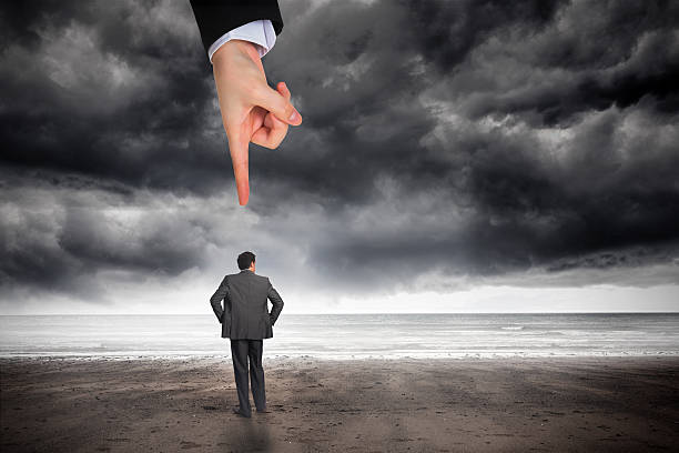 istock Giant hand pointing at businessman with hands on hips 490205461
