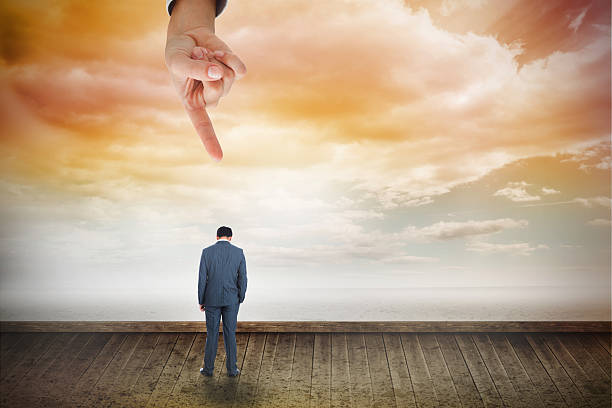 istock Giant hand pointing at businessman standing 490205483