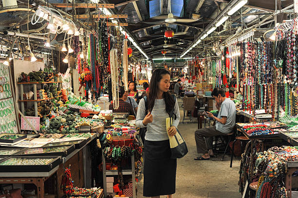 Young Chinese woman shopping at the jade market stock photo