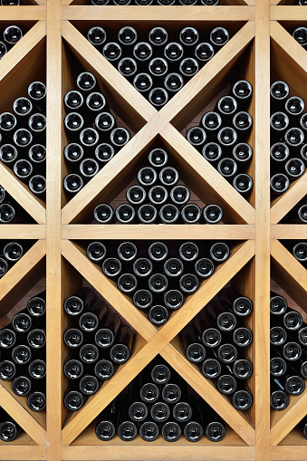 Close-up the collection of wine bottles and wine rack.