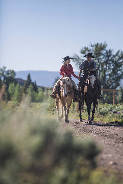 istock Couple riding a horse in Montana 490211308
