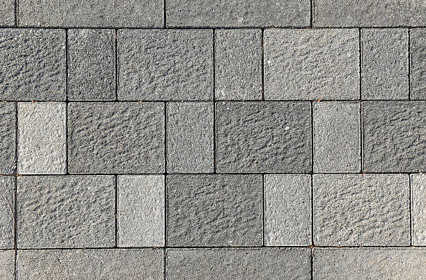 istock Concrete or cobble gray pavement slabs or stones. 490211620