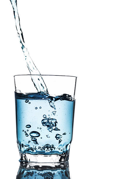 istock Poured water into glass isolated 490211944