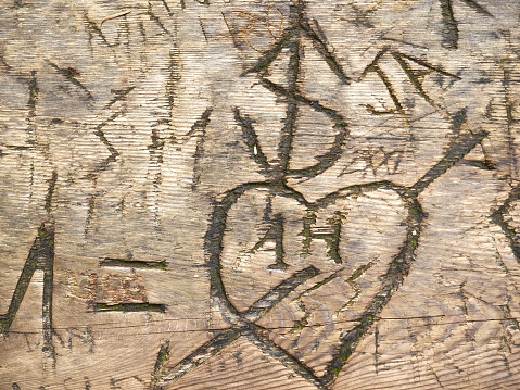 Wood structure, carved letters, heart