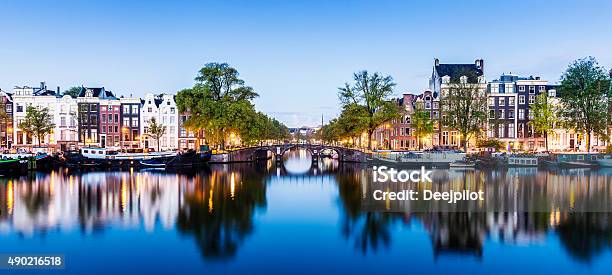 Bridges And Canals Of Amsterdam Illuminated At Sunset Holland Stock Photo - Download Image Now