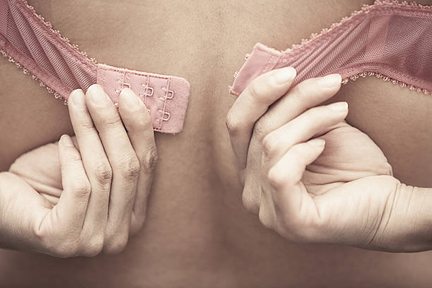 la brasserie - undressing bra women rear view photos et images de collection
