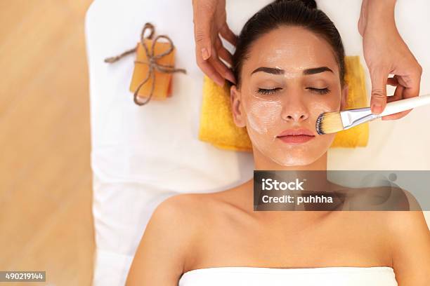 Face Treatment Woman In Beauty Salon Gets Marine Mask Stock Photo - Download Image Now